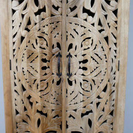 Tall ornate carved natural wood shelved cupboard