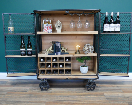 Industrial metal mesh drinks display cabinet on wheels.