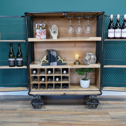 Industrial metal mesh drinks display cabinet on wheels.