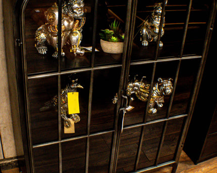 Glass fronted metal storage floor display cabinet.