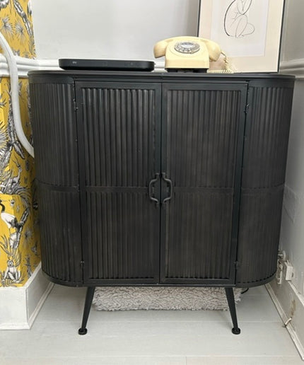 Curvy ribbed metal industrial retro storage cabinet