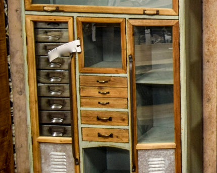 Tall green wood & metal multi drawer industrial storage cabinet.