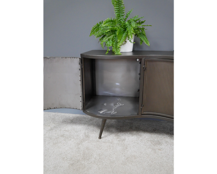 Large curvy ribbed metal storage cabinet